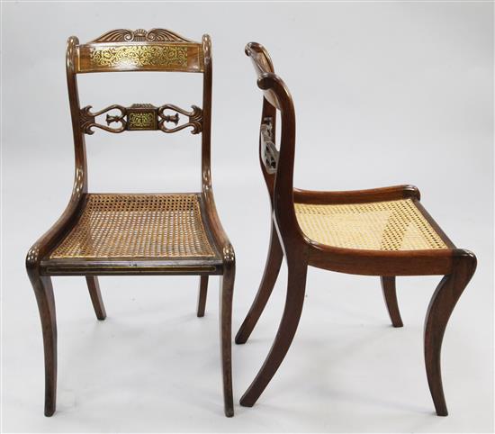 A set of six Regency rosewood and brass inlaid dining chairs,